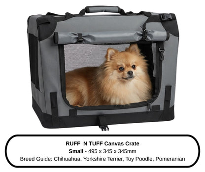 Pomeranian relaxing next to the Small Ruff N Tuff dog crate, lifestyle setting